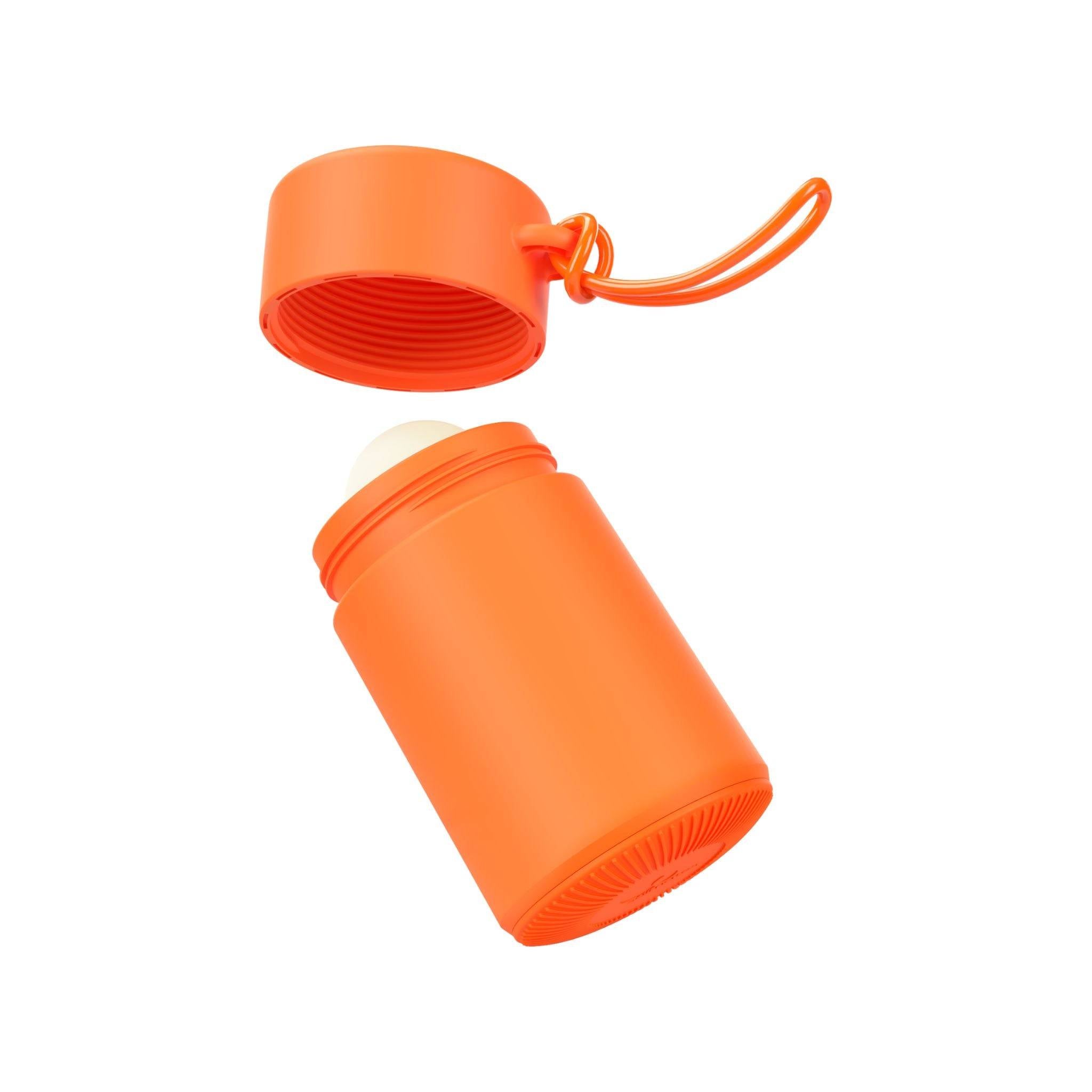 Orange refillable roll-on travel applicator with lid off and above body