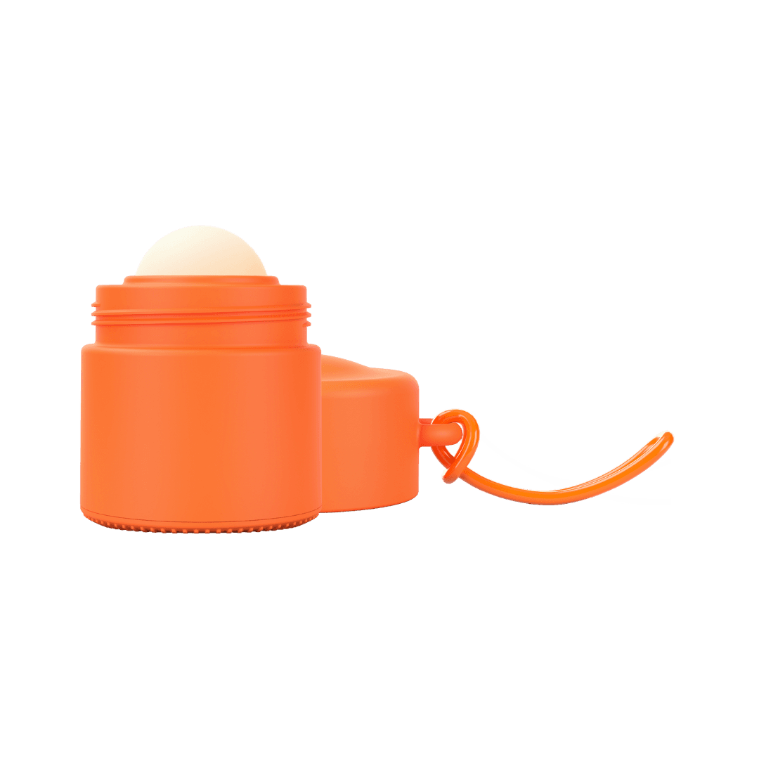 Orange refillable roll-on travel applicator with lid to side