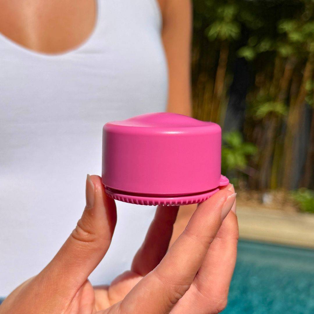 Yellow travel refillable pot held in hands