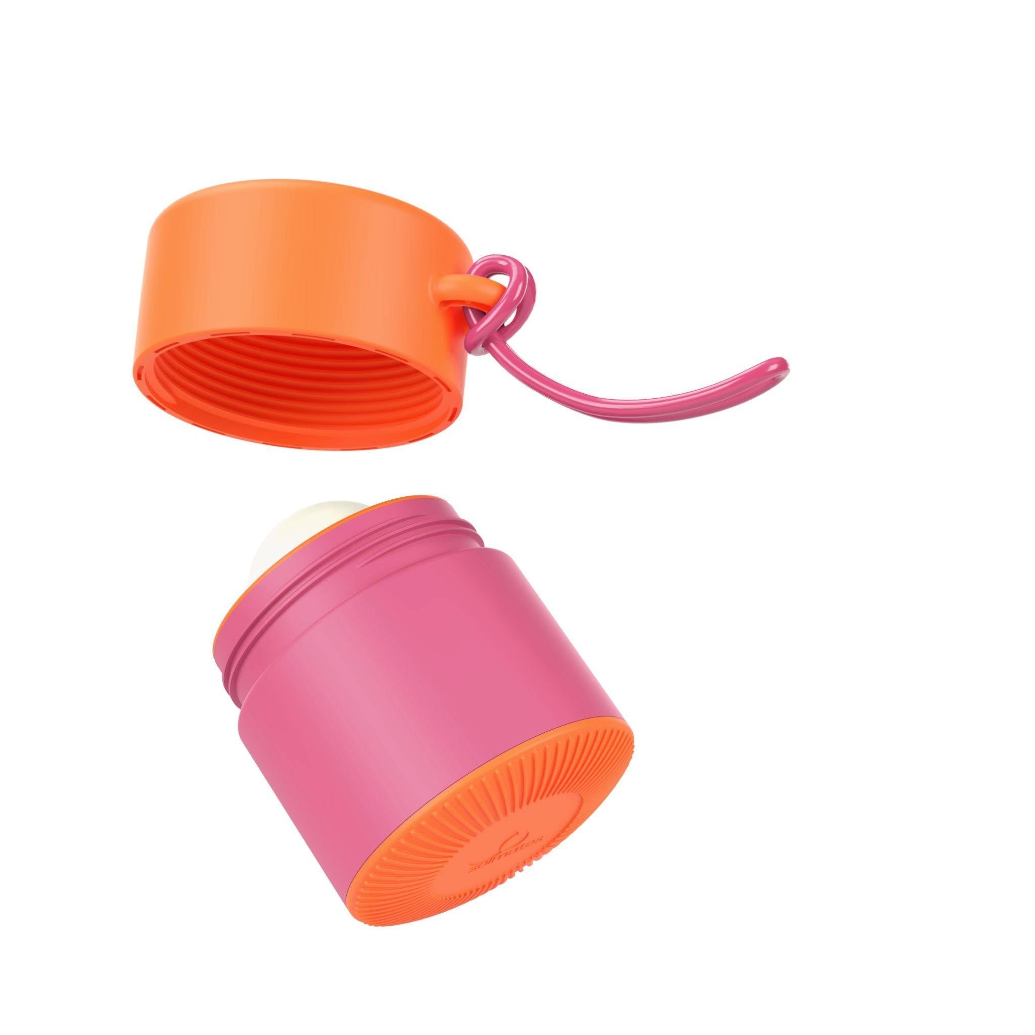 Pink and orange refillable roll-on travel applicator with lid off and above body