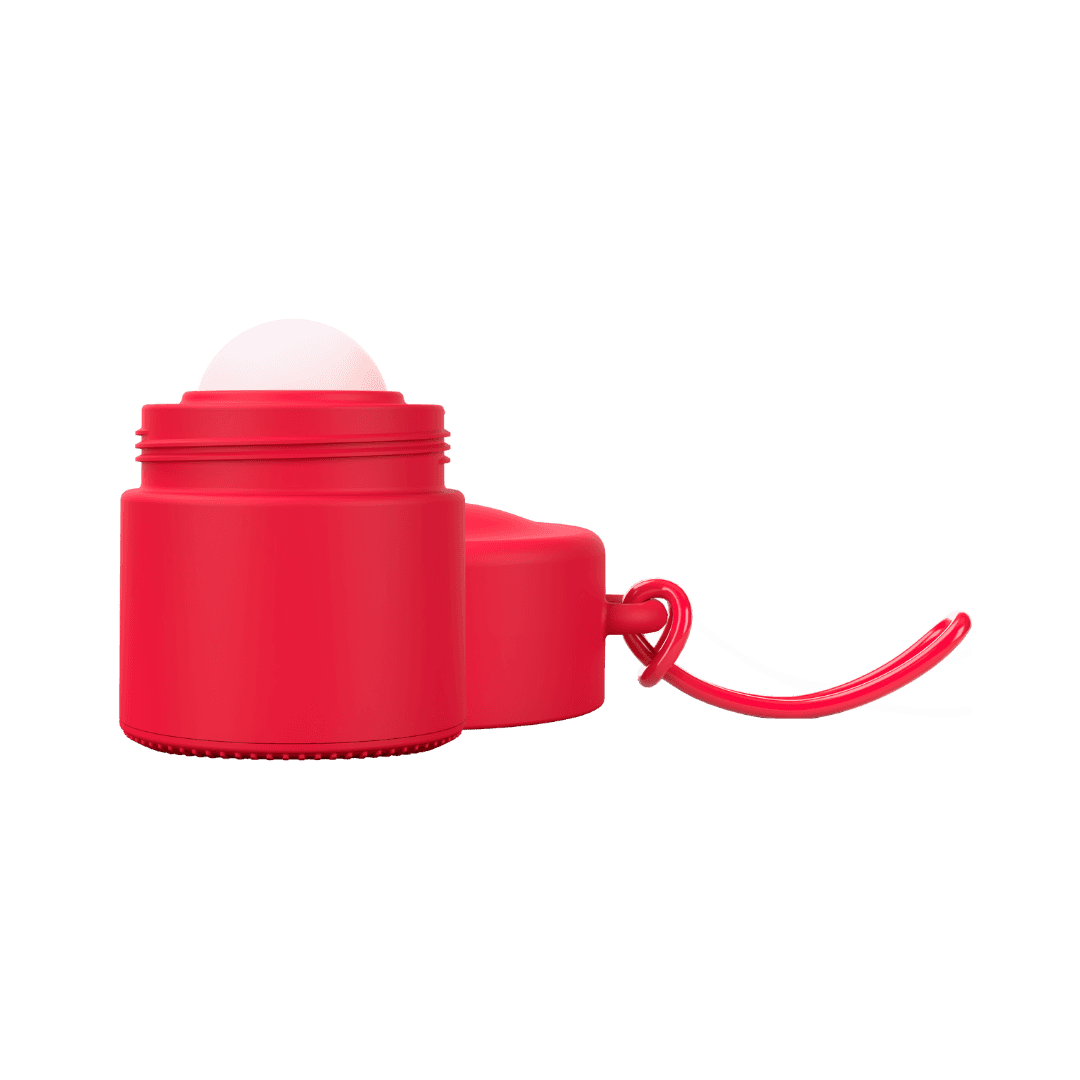 Red refillable roll-on travel applicator with lid to side