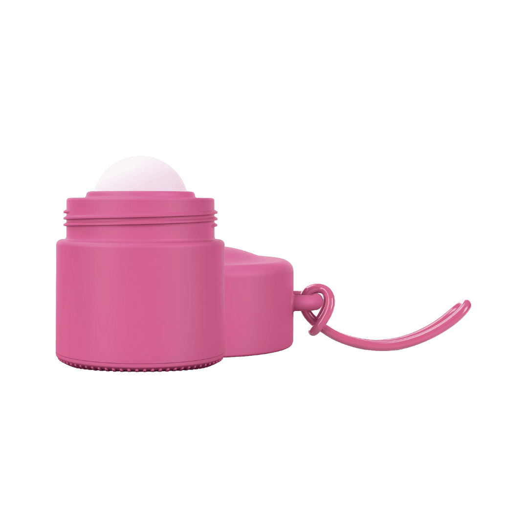 Pink refillable roll-on travel applicator with lid to side
